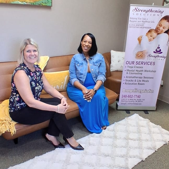 Strengthening Solutions founder Twanda Lane with a Christian Financial Credit Union representative at the Strengthening Solutions office.